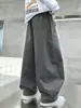 Calça Casual com Barra Curva Nova Moda Outono 2026 para Meninos, Calça Longa Solta Estilosa e Versátil para Crianças e Pré-adolescentes, Primavera e Outono