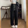 Pantalones de trabajo de algodón puro de moda para primavera y otoño, unisex, diseño casual americano, corte holgado, versátiles y con una silueta de pierna recta y fluida.