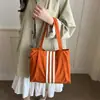Bolso tote de lona de gran capacidad estilo casual coreano 2026 para mujer, nuevo bolso de mano de moda para estudiantes, adecuado para la escuela y el trabajo