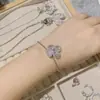 Versa imitación antigua papalacha gema colgante chapado en oro microincrustado diamante rosa camelia circón pulsera
