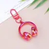 Llavero de Auriculares con Cabeza Tridimensional de Caramelo Sinfonía Acrílica Moda Más Fácil de Combinar Colgante Creativo para Bolsos Colgante para Pareja Mejor Amigo