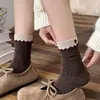Botão de acessório de acabamento de orelha de madeira meias de botão meias femininas de cano médio Outono Inverno Meia folgada estilo garota japonesa ins sem costura