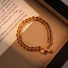Joia de Mão de Caqui da Sorte e Amendoim: Pulseira de Cristal Amarelo, Nova Pulseira Estilo Chinês de Caqui e Amendoim para Mulheres, Design de Nicho de Alta Qualidade para Uso em Camadas