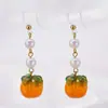 Pendientes festivos rojos de Año Nuevo pendientes largos nupciales vintage pendientes populares de celebridad de Internet Pendientes de Año Nuevo del Dios de la Riqueza clip para la oreja