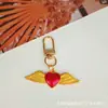 Chaveiro Estilo Gótico Transfronteiriço, Acessórios de Pingente de Metal Retrô, Asas de Coração de Pêssego, Pingente de Cruz Escura