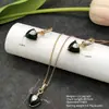 Conjunto de pendientes y collar Xuping estilo vintage de nicho europeo y americano transfronterizo, conjunto de joyería elegante de aleación de cobre, venta al por mayor y hecho a medida