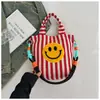 Bolso de hombro de lona casual, bolso de mano a rayas con cara sonriente, bolso cruzado, bolso para tutorías de estudiante, bolso lindo y artístico
