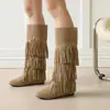 Botas de color liso transfronterizas de talla grande, botas de tubo alto versátiles para otoño e invierno para mujer, suela de goma, antideslizantes, botas de comercio exterior, botas slip-on de tacón plano con borlas