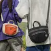 Atacado transfronteiriço nova bolsa de mão coreana de nicho com cor contrastante bolsa de sela de lona bolsa de ombro único transversal bolsa de celular para atividades ao ar livre