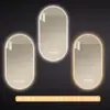 Espejo de baño inteligente ovalado para pared salón de belleza con luz pantalla táctil LED inducción antivaho espejo de tocador HD