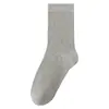 Calcetines grises para mujer, calcetines de media pantorrilla de moda, calcetines de algodón de color liso para otoño e invierno, estilo ballet japonés combinados con zapatillas de entrenamiento alemanas, puño suelto apilado