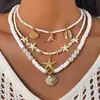 Collar colgante de la nueva serie oceánica de verano, collar accesorio multicapa fresco y simple de estrella de mar de la costa para mujer, estilo coreano ins