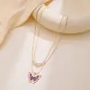 Deseo AliExpress nueva moda europea y americana muñeca Barbie con collar de mariposa para niña cadena doble de perlas joyería lote