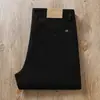 Pantalones casuales rectos holgados de negocios de sarga de lijado elástica de cintura alta para hombre, nuevos de otoño e invierno 2024, color caqui