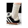 Calcetines largos a rayas y de lunares, modernos, dulces y lindos, para estudiantes, estilo coreano, perfectos para otoño e invierno, con etiqueta de tela y longitud hasta la mitad de la pantorrilla.