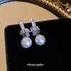 Aretes de perlas anudadas de circón de aguja plateada, aretes de estilo elegante y moderno de lujo ligero, aretes simples personalizados de alta gama al por mayor