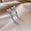 Pendientes de Plata con Baño de Oro Real de 18K, Aguja de Plata, Zirconia, Lazo con Borla, Pendientes de Lujo Ligero de Alta Gama, Pendientes Transfronterizos Europeos y Americanos