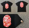 Camiseta unisex de manga curta da marca tendência BAPE, co-branded com design de camuflagem de cabeça de macaco, caimento solto de alta qualidade