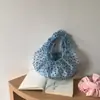 Bolsa coreana con diseño de nicho, estilo femenino, bolsa de lunares plisada, nuevo modelo de verano 2026, bolso de mano casual suave