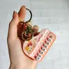 Nuevo Llavero de Mini Piano Transfronterizo Dibujo Animado Lindo Tocando el Piano Sanrio Juguete Musical Colgante Pequeño