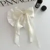 Clip de resorte con lazo de perla, accesorio para el cabello de alta gama, elegante y francés para celebridades de Internet.