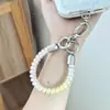 Exquisita cadena para teléfono móvil, cordón de alta gama para teléfono móvil, cordón elástico de cristal, anillo corto para dedo, correa anti-pérdida para teléfono móvil