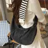 Colección de otoño 2026 transfronteriza: Bolsa de mezclilla tipo dumpling de gran capacidad, a la moda, estilo coreano, simple y adecuada para ir al trabajo