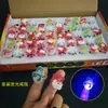 Anel de brinquedo luminoso de Natal pequeno presente presente Natal desenho animado luz de dedo empurrar jardim de infância quente atacado
