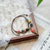 Taobao nuevo brazalete de cerámica Jingdezhen estilo nacional nuevo estilo chino estilo nacional tejido cuentas de porcelana cuerda de mano alto sentido