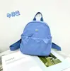Mochila Nova Mochila de Tecido de Nylon Impermeável Moda Ins Estilo Transfronteiriço Casual Baistu Bolsa de Viagem