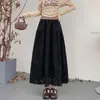 Nueva falda larga plisada hueca de gamuza estilo americano vintage para otoño e invierno en negro