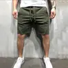 Pantalones Deportivos Transfronterizos Estilo Europeo y Americano para Hombre Lisos para Correr y Entrenamiento Color Sólido Exportación Pantalones de Cinco Puntos