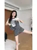 Conjunto de Saia-Calça Xadrez Irregular Novo Outono 2026 Moda Solta Estampada Camiseta de Manga Longa Conjunto de Duas Peças