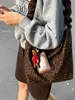 Bolsa de Hombro Cruzada de Moda Otoño e Invierno Transfronteriza para Mujer 2025 Nueva Bolsa Cubo Estampado de Leopardo Bolso Cruzado de Hombro Plegado