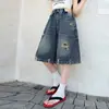 Verano 2026 Nuevos Shorts de Mezclilla Lavados Rasgados de Cintura Alta Estilo Retro Americano para Niñas, Pierna Ancha Suelta, Capris de Cinco Puntos