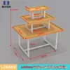 Expositor Promocional Papelería Isla para Madre y Bebé Apilador Gabinete de Exhibición de Cosméticos de Alta Calidad Mesa Flujo de Tres Niveles Estantería de Acero y Madera