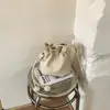 Bolso Cubo con Cordón Estilo Coreano para Mujer 2026 Primavera Nuevo de Moda Nicho Simple para Viajar de Alto Valor Elegante Bolso de Hombro Cruzado