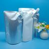 Bolsa transparente con boquilla en stock de fábrica 500ML blanco leche bolsa con boquilla autosoportable champú auto sellante bolsa con boquilla para líquidos