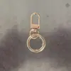 Llavero de aleación de zinc hebilla de resorte aro de resorte colgador de puerta llavero accesorio para juguete DIY accesorio para muñeca colgante