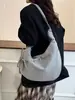 Bolsa de lona de gran capacidad para mujer, nuevo diseño de moda nicho otoño 2026, bolso de hombro y bandolera, bolsa tipo empanada para el día a día