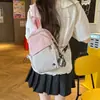 Mochila pequena portátil versátil para estudantes homens de grande capacidade em duas cores, bolsa de peito cruzada simples estilo japonês para mulheres