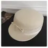 Estilo Chanel de mil oros~ Gorra ecuestre de bloque de color con lazo de lana japonesa para mujer, nueva gorra de fieltro de pico de pato de invierno 2025