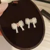 Suporte de Borboleta com Luz Brilhante: Brincos de Pérola com Laço Cravejado de Diamantes, Brincos com Atmosfera Feminina, Acessórios de Orelha Estilo Fresco e Doce Atacado