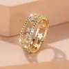 Anillo Femenino Rongxing Transfronterizo Europeo y Americano Estrella Hueca Anillo con Textura de Perla de Arroz Banda Hueca Incrustada con Pedrería Anillo Decorativo Diario