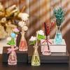 Venta al por mayor de fábrica botella de vidrio cónica para aromaterapia, botella difusora de perfume de fragancia, botella vacía estilo ins, botella de aromaterapia de ratán sin fuego