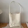 Bolso de mujer de nicho transfronterizo de alta gama, nuevo bolso tote con patrón tejido vintage con neceser a juego, bolso de hombro para el día a día, moderno