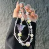 Corrente de celular cristal borboleta e flor estilo fada, corrente dupla com contas de cristal, acessório de bolsa de pulso anti-perda, tendência popular online