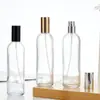 Botella de perfume personalizada de 100 ml, botella con atomizador de presión, botella de vidrio transparente cilíndrica simple con cierre de bayoneta, botella vacía para recarga de perfume