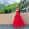 Vestido Estilo Resort 2026 Nuevo Modelo Rojo Impresionante Cuello Halter Cuello en V Vestido Largo para Viajes y Ropa de Playa