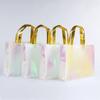 En stock Explosiones Agua de Lluvia Película de Aluminio Láser Bolsa de Tela No Tejida Bolsa de Compras Amazon Bolso Dorado Compuesto